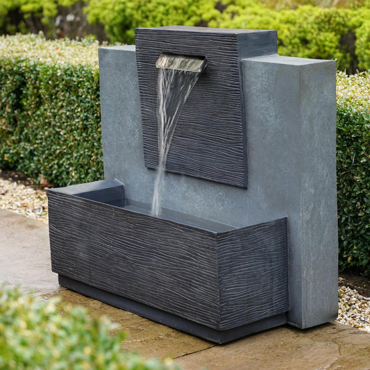 Enhance Your Garden: Elevate Outdoor Charm with Water Features and Log Storage Sculptures from Refined Home Living